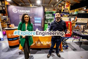 Nickolas and Leticia from Alpha Mill and PTMA at the Explore Engineering event with CNC